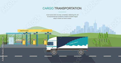 Semi-truck on the road and Gas filling station on city background	