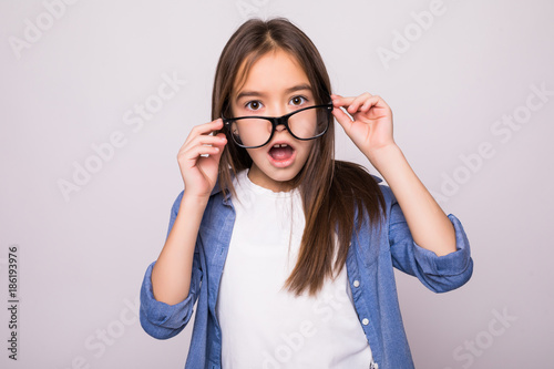 shocked beauty little girl isolated on grey background