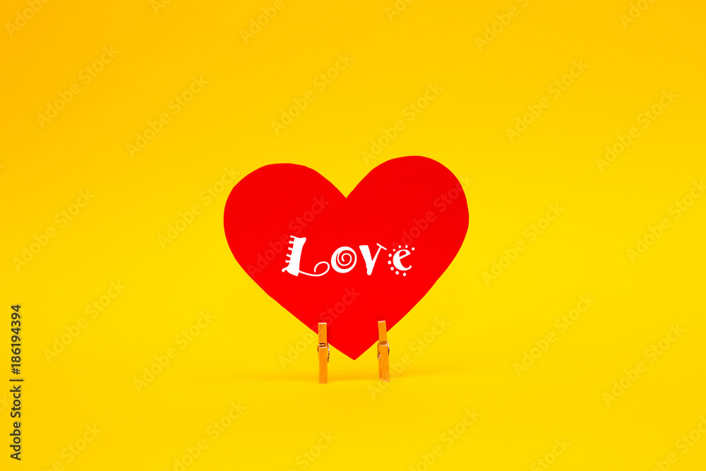 Happy Valentines Day card with red paper heart on yellow background