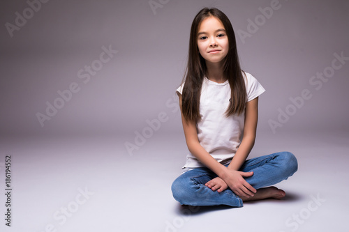 lovely little girl sitting on the floor on white background Free Download lovely little girl sitting on the floor on white background - GFXLoad