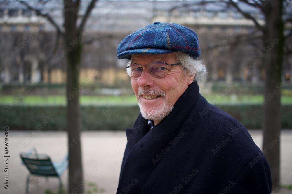 Man in Harris Tweed Hat - walking in Paris park