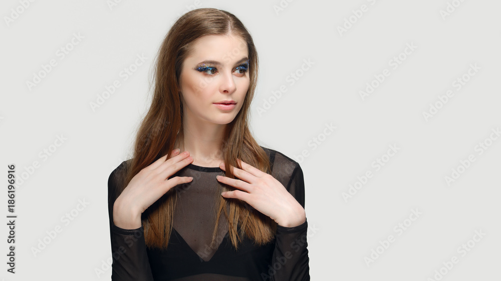 Surprised girl with creative makeup sparkles on the eyes. Surprised girl with creative makeup sparkles on the eyes.