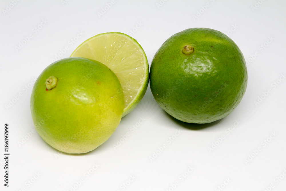 Half of lime citrus fruit isolated on white background. Sliced lemon half Half of lime citrus fruit isolated on white background. Sliced lemon half