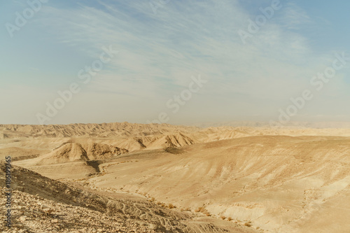 Landscape of mountain hill dry desert in Israel. Valley of sand  rocks and stones in hot middle east tourism place.