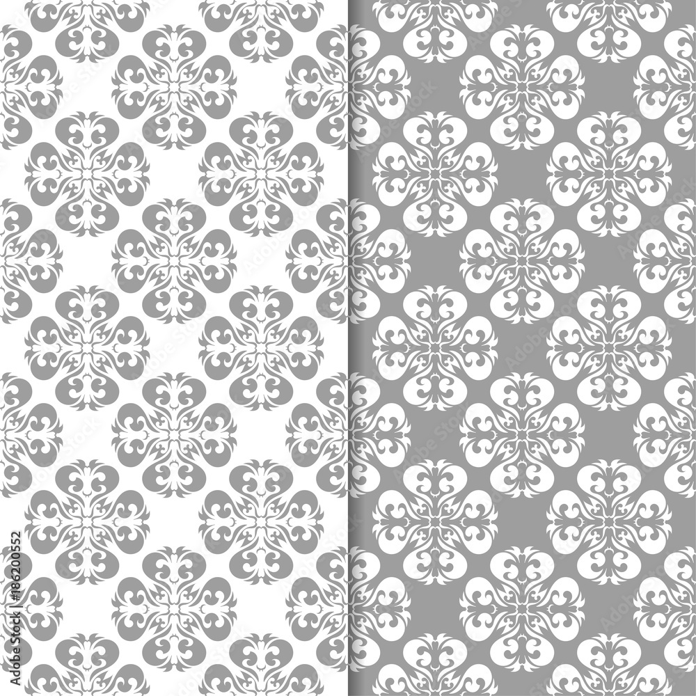 White and gray floral ornaments. Set of seamless backgrounds