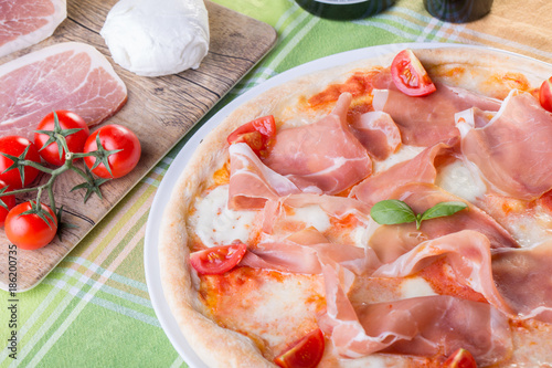 close up of italian pizza with ham