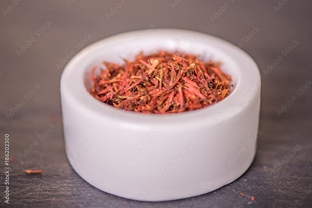 Fototapeta premium saffron raw organic dried Saffron in a spoon selective focus, macro shot, shallow depth of field