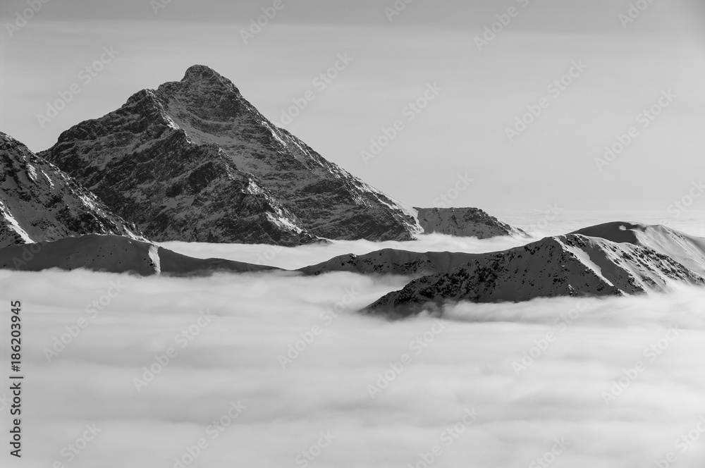 Naklejka premium Krywan. Slovak High Tatras. Winter view during inversion.