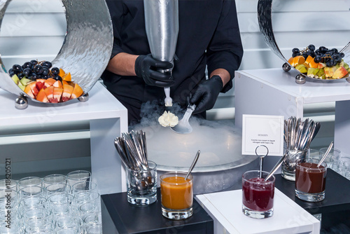 Fotografie Making ice-cream with liquid nitrogen, chef show