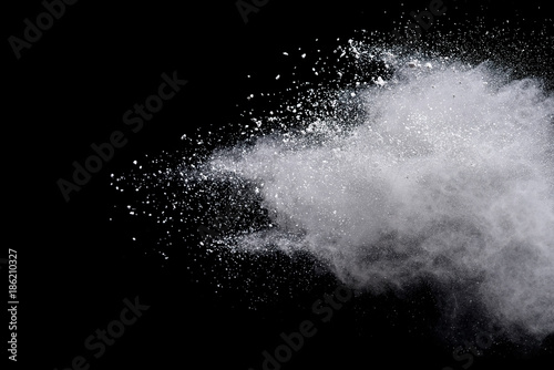 Fototapeta Naklejka Na Ścianę i Meble -  Freeze motion of colored powder explosions isolated on black  background.