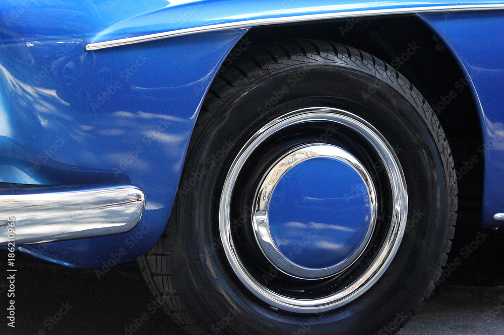 Car wheels close up on a background of asphalt. Car tires. Car wheel close-up