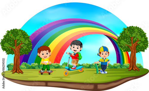 Children playing in the park on rainbow day 