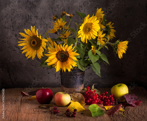 Still life with sunflowers and fruits