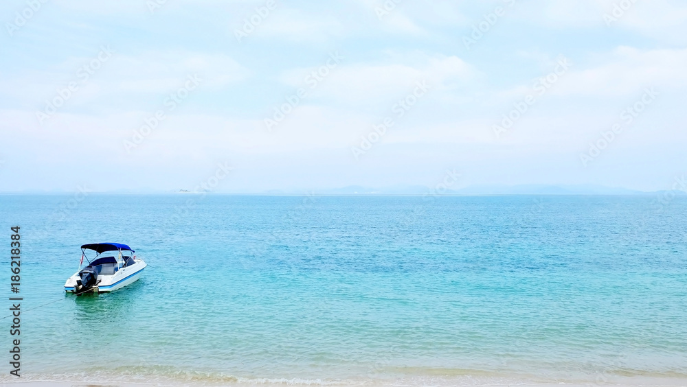 Fototapeta premium Speedboat, beach, coastline and blue sky