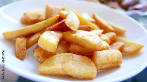 Potato fries on the light brown basket dish