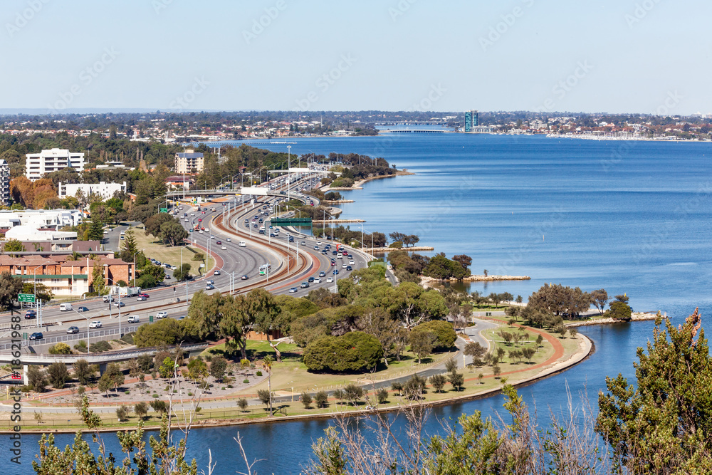 The Kwinana Freeway at Mill Point Road in Perth, Western Australia winds it's way along the Swan River heading south towards Mandurah.