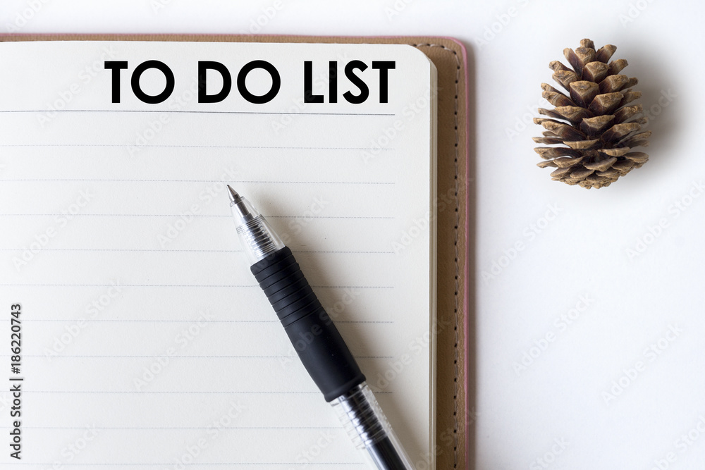Conceptual,notebook on a white table. open diary and pen with to do list words