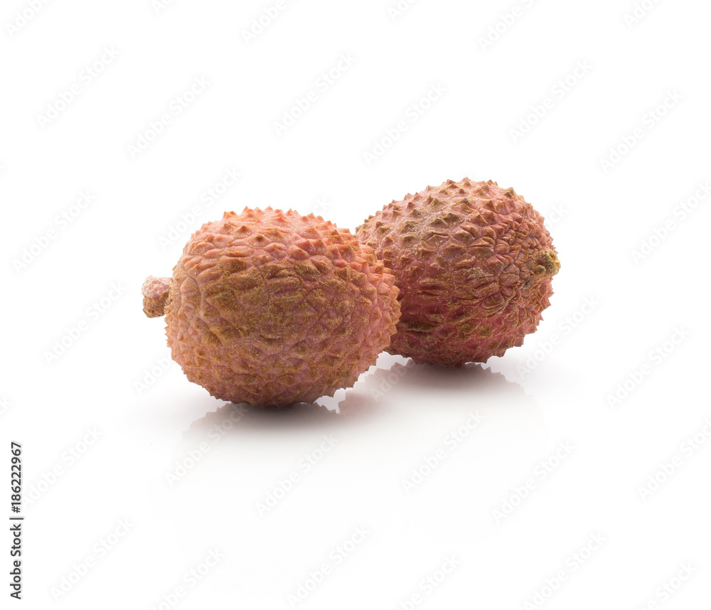 Two lychee isolated on white background ripe pink fresh berries. Two lychee isolated on white background ripe pink fresh berries.