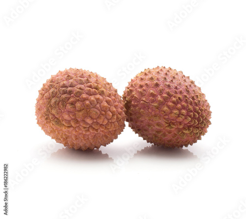 Lychee isolated on white background ripe pink fresh two berries.