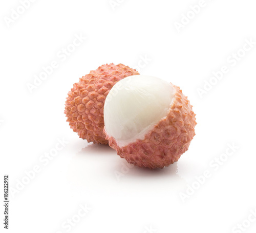 Two peel lychee isolated on white background ripe pink fresh berries.