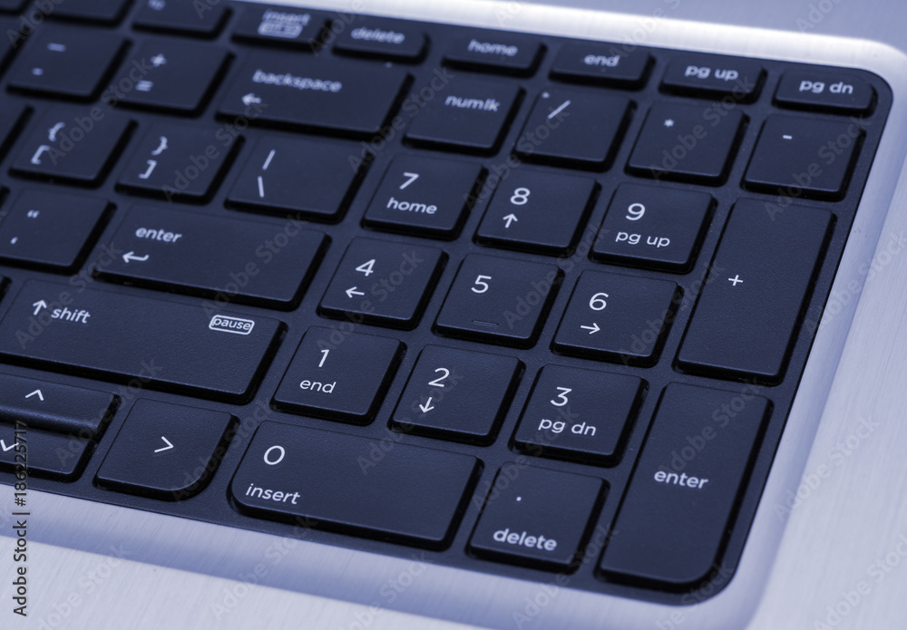 Top View of Keyboard closeup blue background banner Top View of Keyboard closeup blue background banner