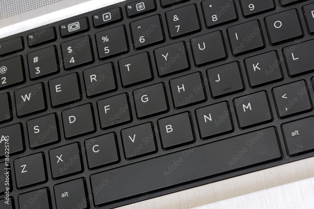 Top View of Keyboard closeup blue background banner Top View of Keyboard closeup blue background banner