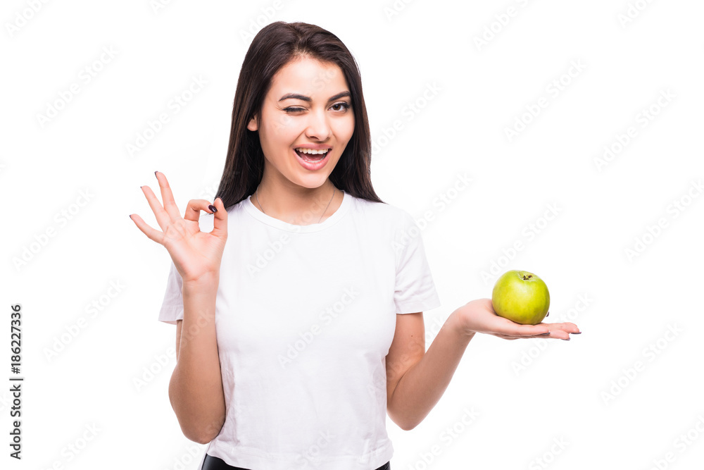 healthy woman giving ok hand gesture with green apple on white background healthy woman giving ok hand gesture with green apple on white background