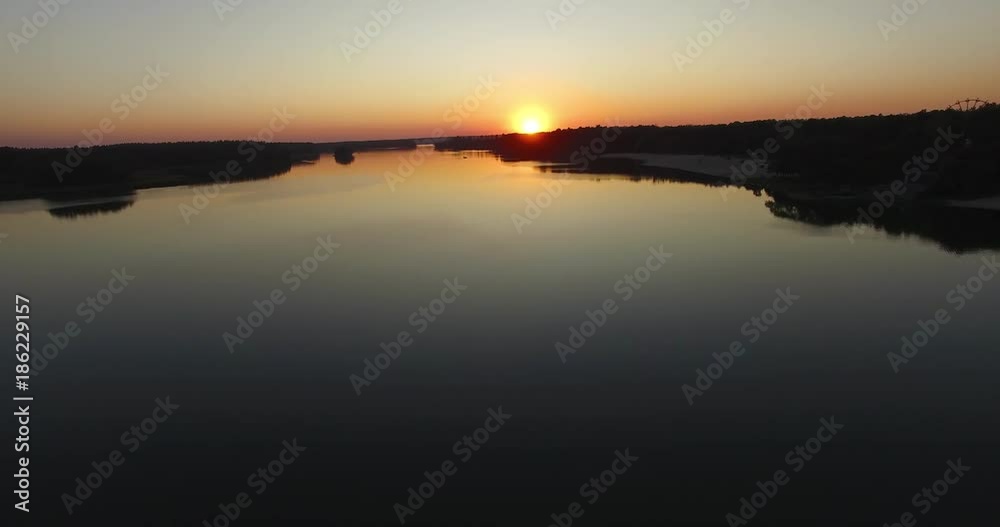 Sunset over river reflection sun rays in water Sunset over river reflection sun rays in water