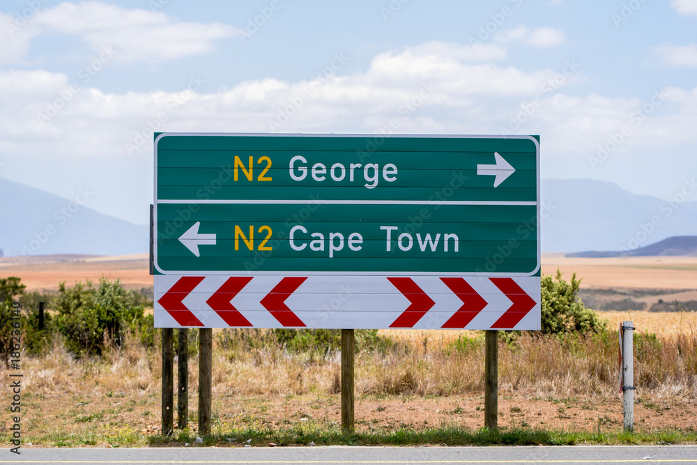 Road sign at the route N2 road in South Africa near Still Bay pointing to  Cape
