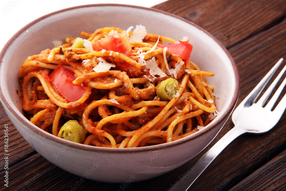 Italian pasta - Bolognese, fresh vegetables - cuisine Italian pasta - Bolognese, fresh vegetables - cuisine