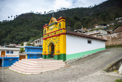 Colour facade of the church in the San Andres Xecul in Guatemala, Central America photo