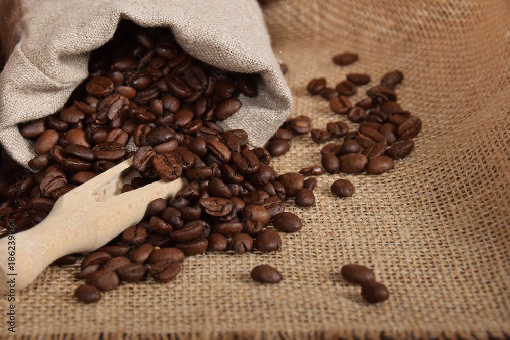 gray bag with roasted seeds of black coffee with free space for text gray bag with roasted seeds of black coffee with free space for text