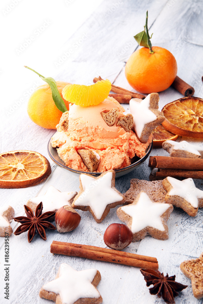 Winter Ice cream with gingerbread and tangerines, on wooden background Winter Ice cream with gingerbread and tangerines, on wooden background