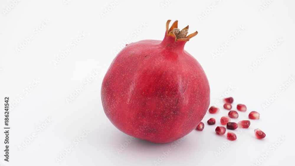 Rotating pomegranate fruit isolated on white background.4K