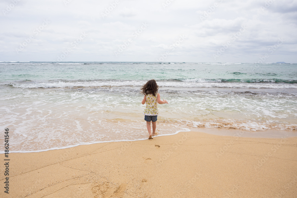 Child Playing on Beach in Oahu Hawaii