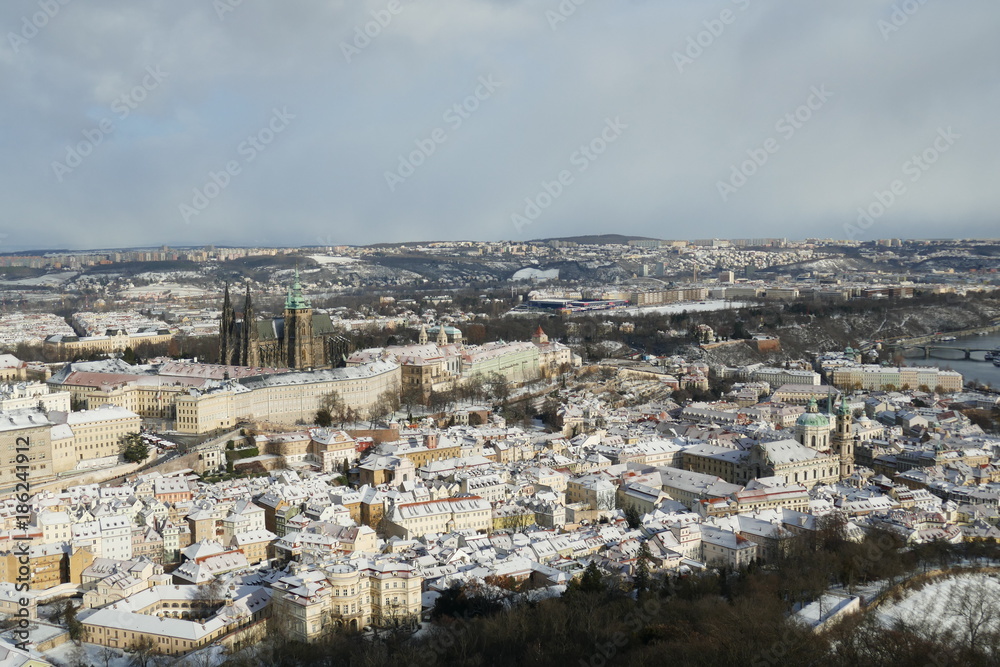Panorama of Prague Cathedral and City skyline in winter snow