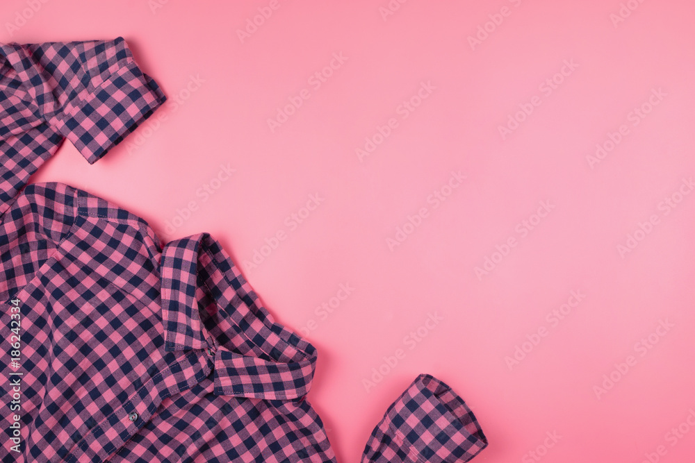 Pink checked shirt on pink background. Copyspace Pink checked shirt on pink background. Copyspace