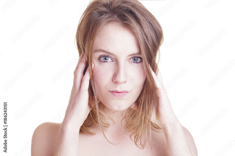 Positive blonde woman looking to the camera. Isolated, over a white wall. Positive blonde woman looking to the camera. Isolated, over a white wall.
