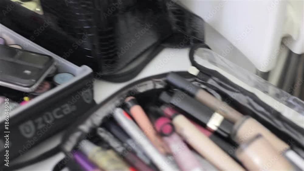 Make-up brushes and products on a table Make-up brushes and products on a table