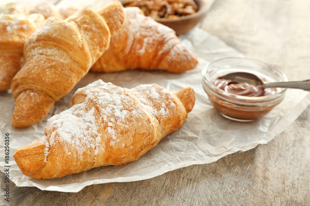 Tasty croissants on table, closeup Tasty croissants on table, closeup