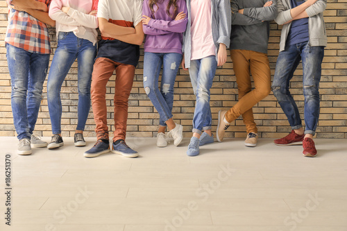 Group of cool teenagers indoors