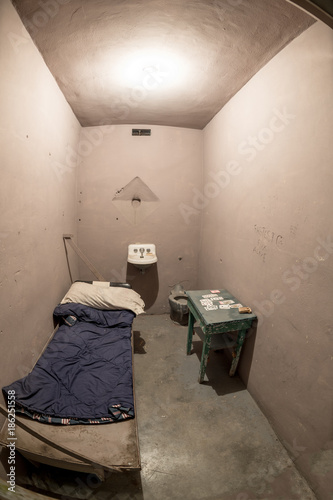 Small Jail cell with bed and playing cards