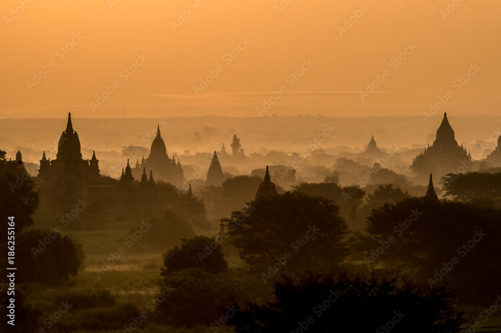 Misty sunrise over pagodas and temples in Bagan, Myanmar