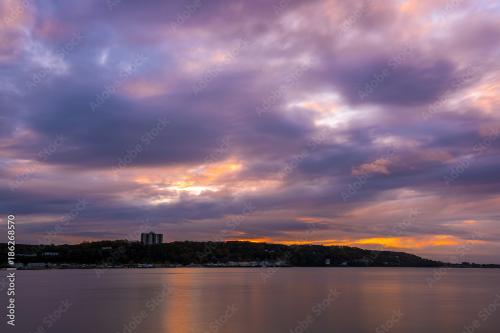 Gloomy evening at Sandy Hook Bay creates and amazing dramatic sky during sunset Gloomy evening at Sandy Hook Bay creates and amazing dramatic sky during sunset