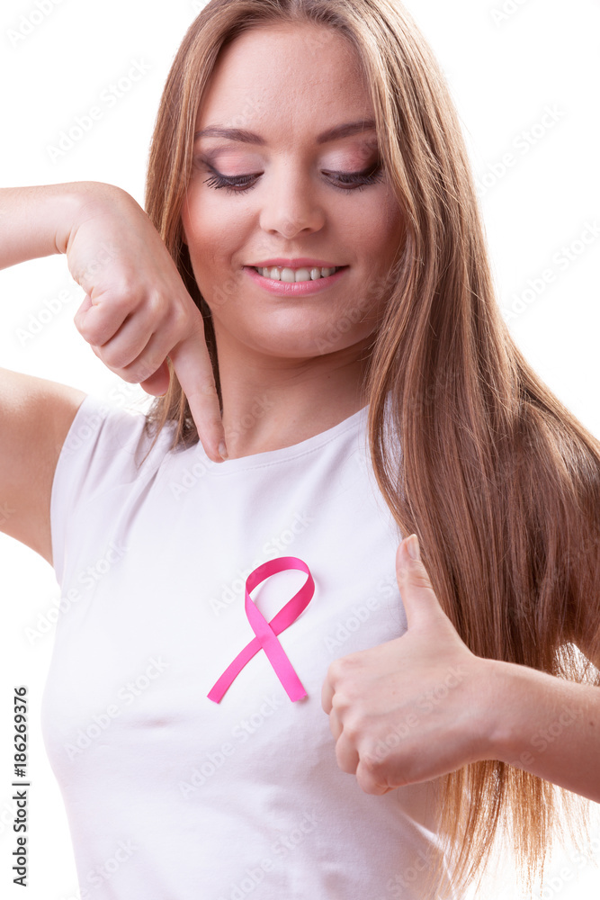 woman pink cancer ribbon on chest making thumb up