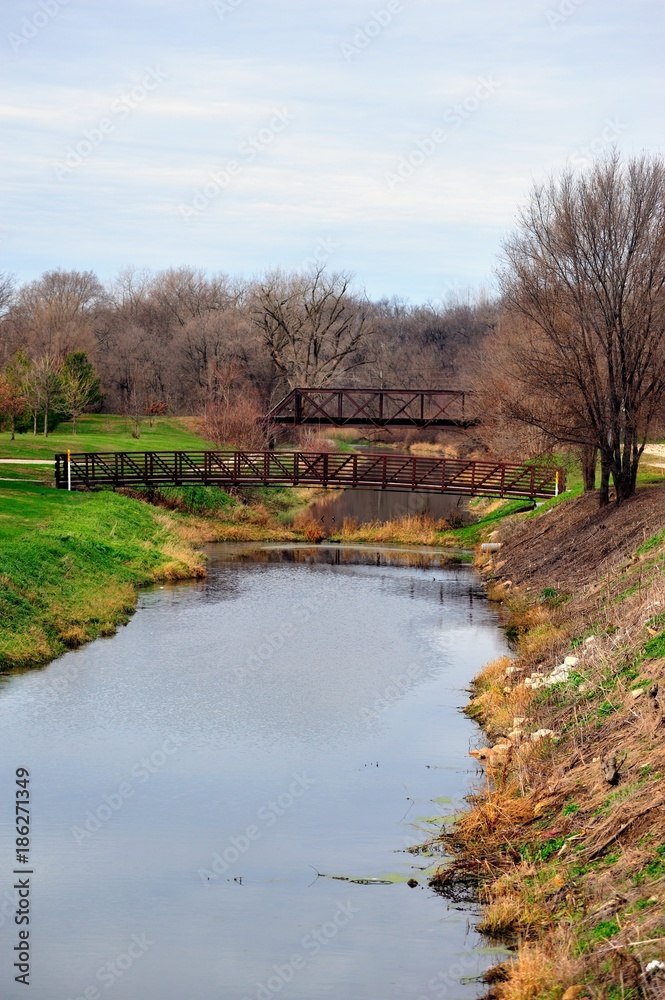 A segment of the Illinois and Michigan Canal as it passes under a railroad bridge in Utica, Illinois. The canal connected the Great Lakes to the Mississippi River and the Gulf of Mexico.