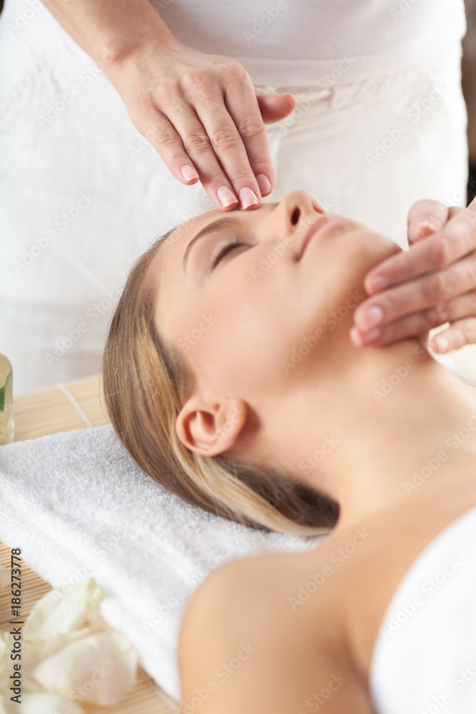 Naklejka premium Portrait of a Woman Having a Head Massage