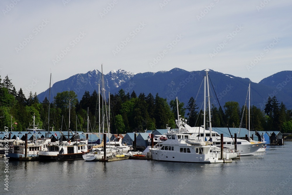 Yachts at the Burrard Inlet, Vancouver, Canada with Mountains in the background