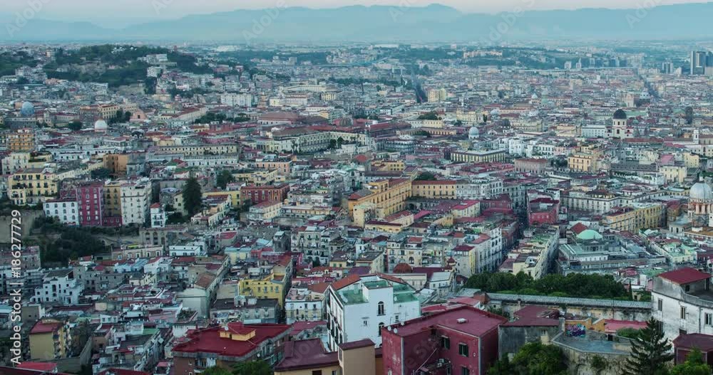 NAPLES, ITALY – JULY 2016 : Timelapse over central Naples cityscape during sunset with amazing landscape and light changing in view NAPLES, ITALY – JULY 2016 : Timelapse over central Naples cityscape during sunset with amazing landscape and light changing in view