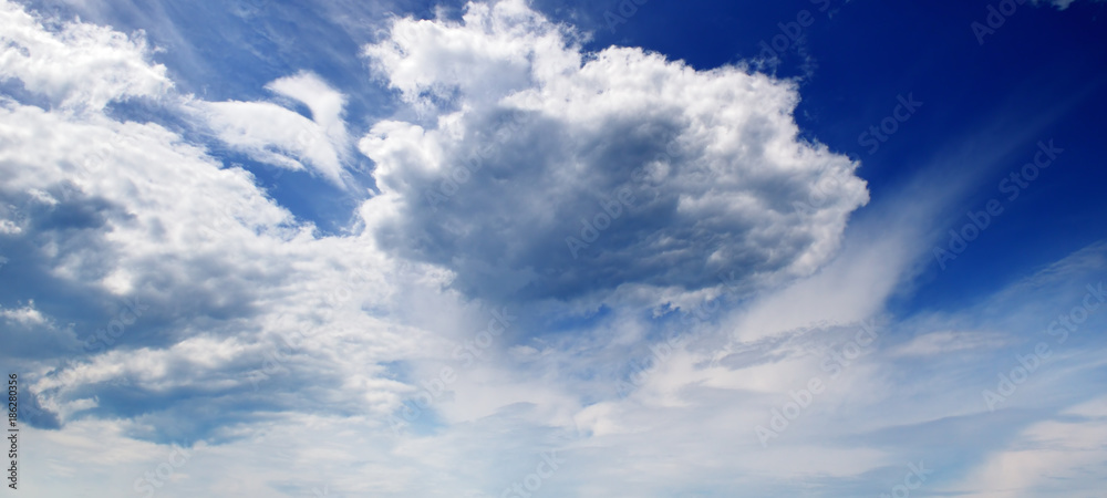 Beautiful clouds slowly flying in the sky. Wide photo. Beautiful clouds slowly flying in the sky. Wide photo.